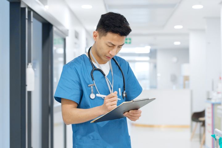 A nurse refers to a nursing care plan for a patient with anemia.