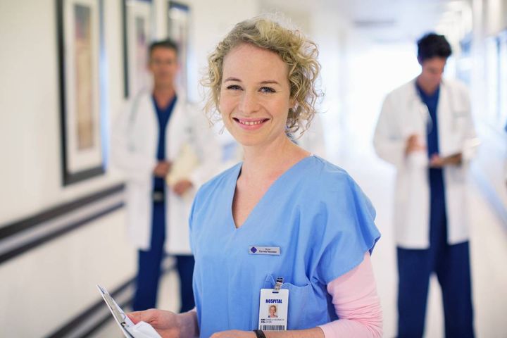 A nurse poses for a photo while discussing the mnemonic for ABC in nursing.