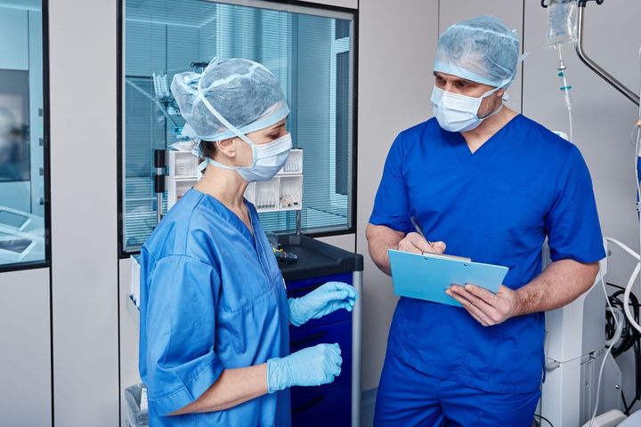 Two CCU nurses in an operating room.