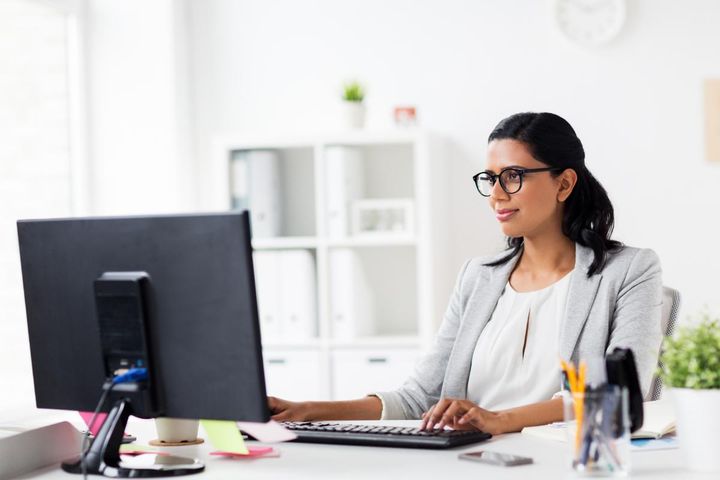 A professional with CDIP certification works on healthcare documentation.