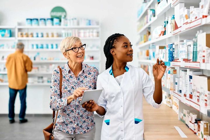Clinical pharmacist helping a patient get medication