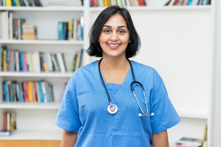 A nurse with CMSRN certification preapres for her next shift.