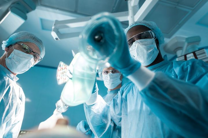 A CRNA assists with a patient prior to surgery.