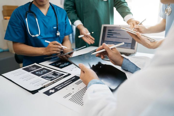 A group of healthcare professionals demonstrate documentation for nurses.