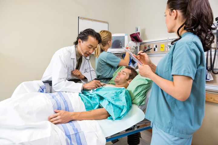 Medical staff attend to a patient in the ED.