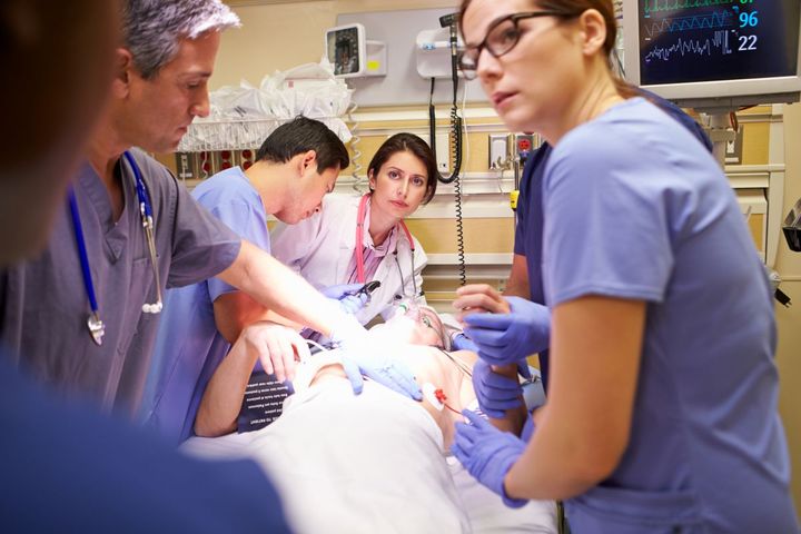 Staff at the emergency department attend to a patient.