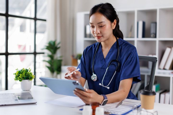 A nurse accesses files made possible through API integration.