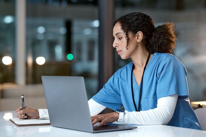 Woman working on a computer in an office