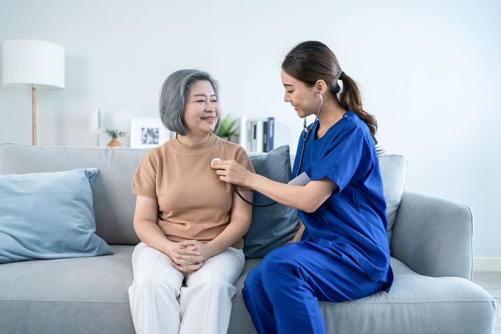 A nurse provides hospital at home care to one of her patients.
