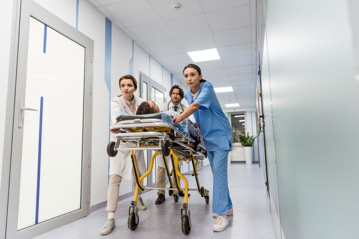 Idaho nurses transport a patient down a hospital hallway.