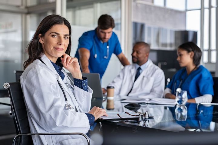 A locum physician works with the staff of a hospital.