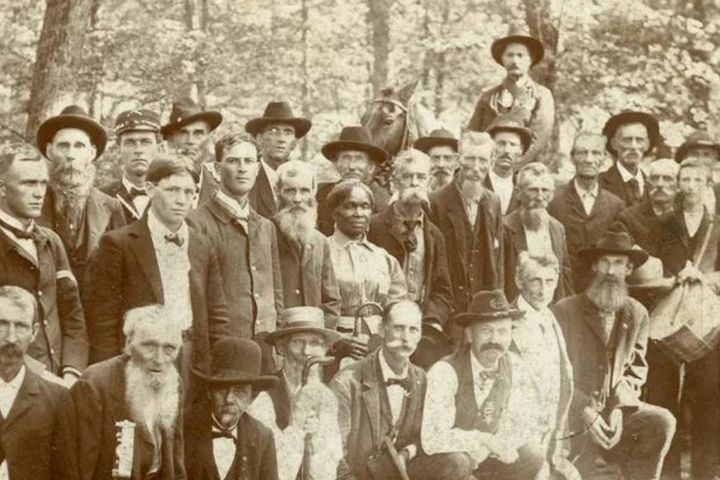 Lucy Higgs Nichols stands with Union soldiers.