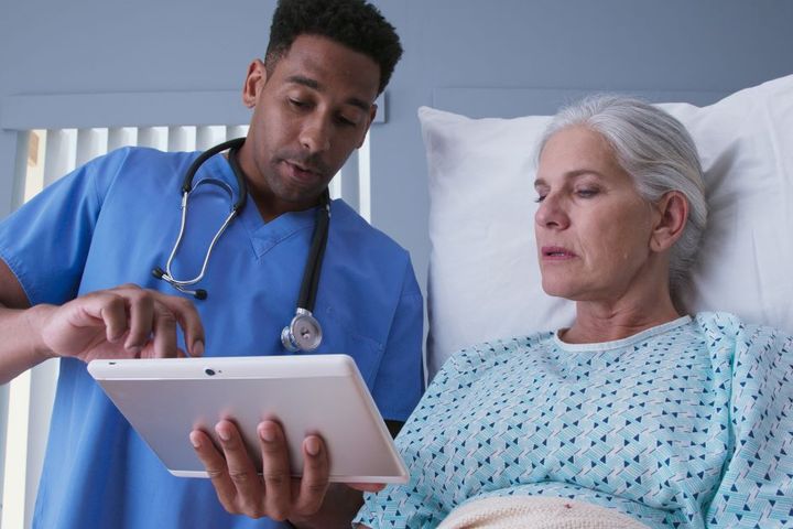 A licensed vocational nurse (LVN) advising a patient.