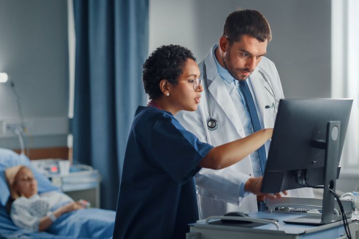 A nurse and physician conduct a national NPI registry search.
