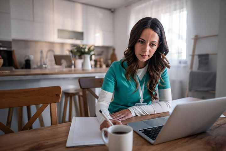 A nursing student reviews NCLEX SATA questions before taking the exam.