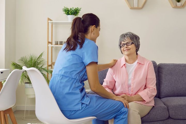 A neuro nurse consoles one of her patients.