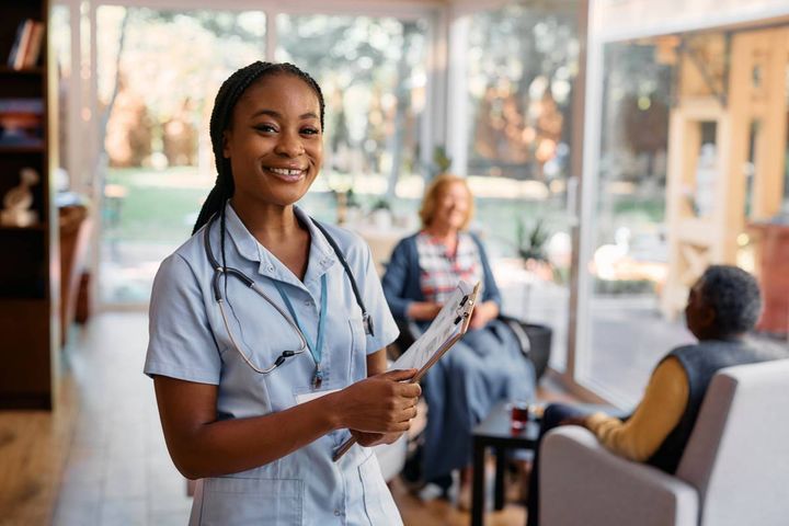 A nursing professional smiles while discussing the top non-hospital nursing jobs she's considering.