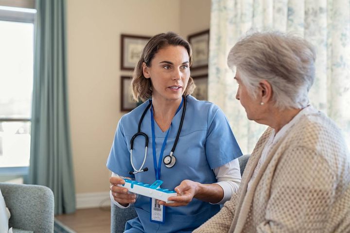 A nurse uses her nurse navigator resume skills.