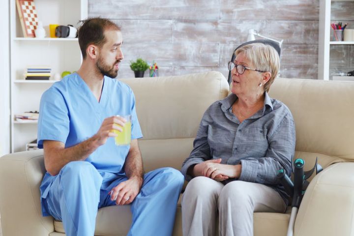 Nurse practicing therapeutic communication