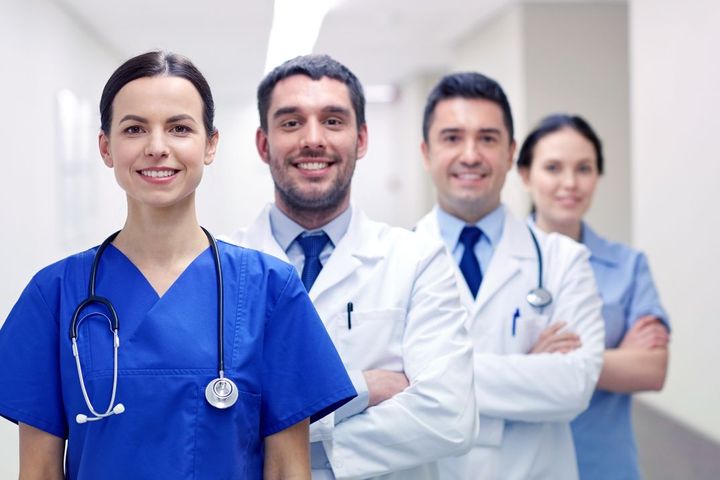 Nurses and clinicians smiling in a medical facility