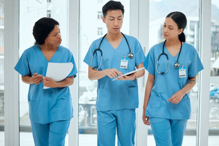 Group of nurses talking in a hallway