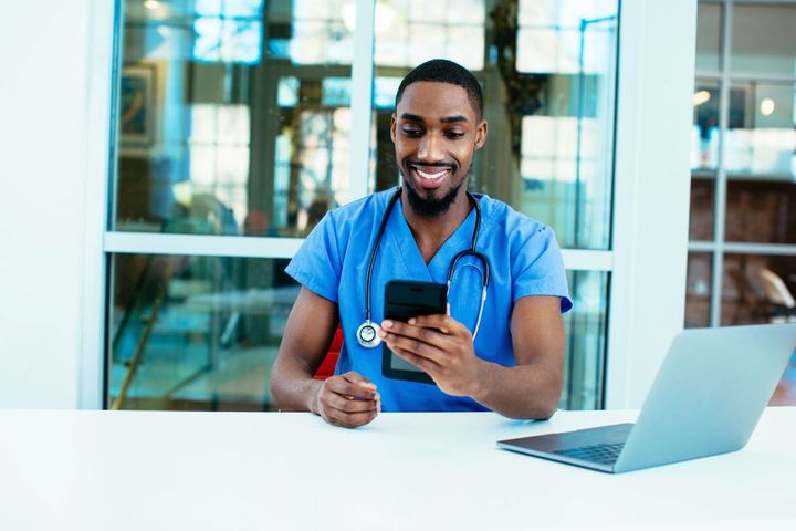 A nurse checks his messages after posting to a nursing job board.