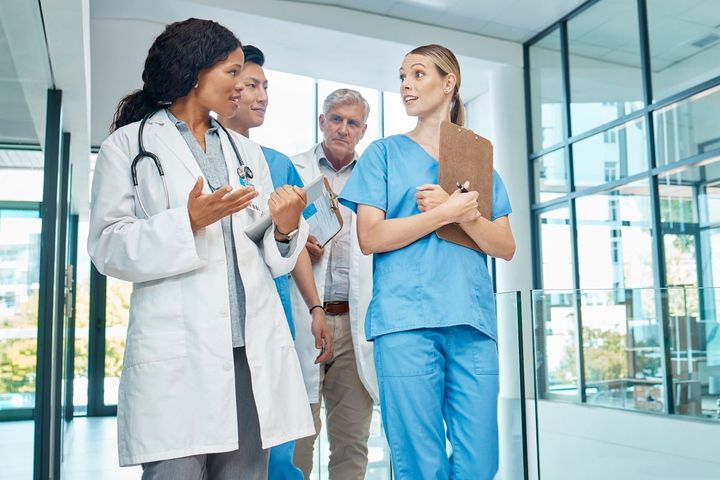 Nurses and physicians having a discussion.