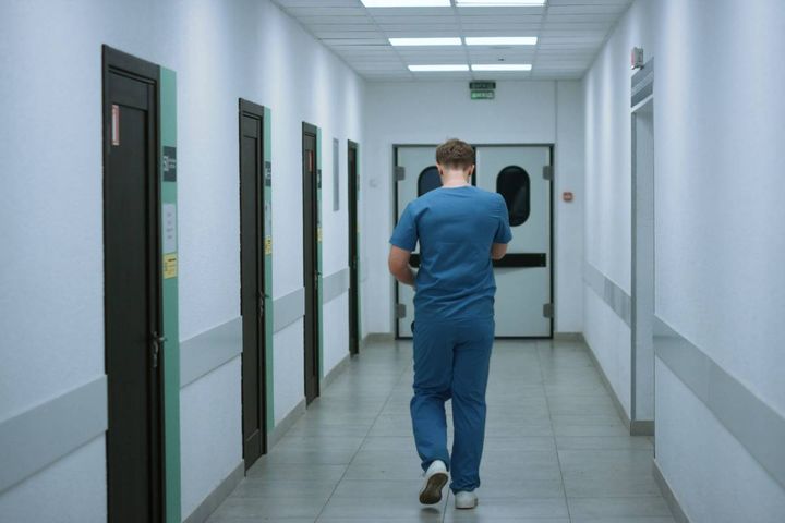 A nurse walks and thinks about reasons for leaving a nursing job.