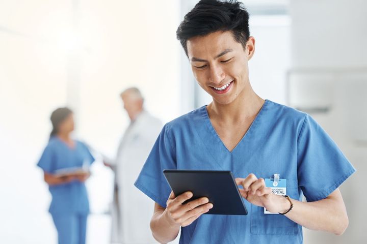 Research nurse using a tablet