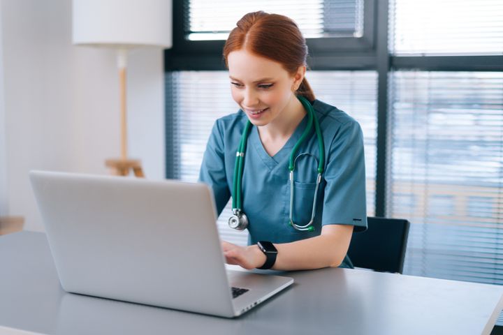 A nurse types up a risk for infection nursing care plan for a patient.