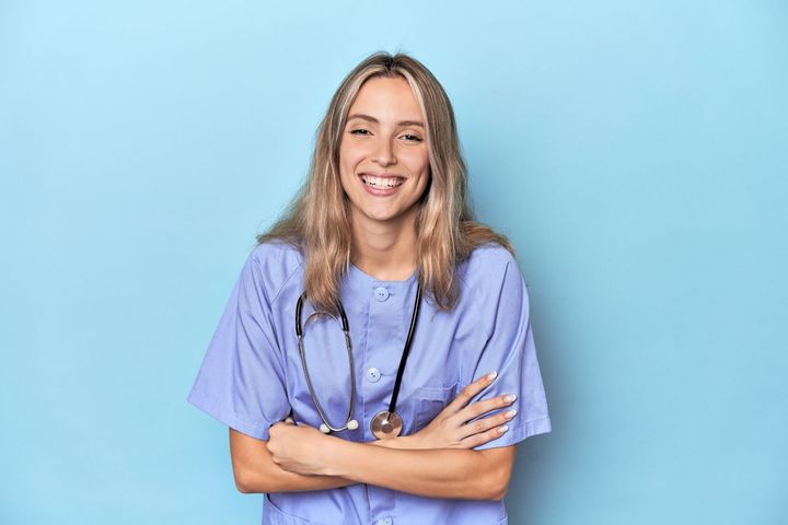 A nurse candidate smiles as she answers RN behavioral interview questions.