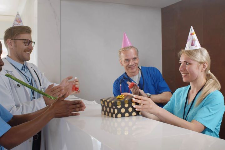 A nurse receives a staff appreciation gift.