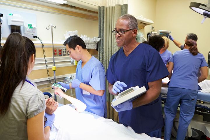 Urgent care nurses tend to a patient.