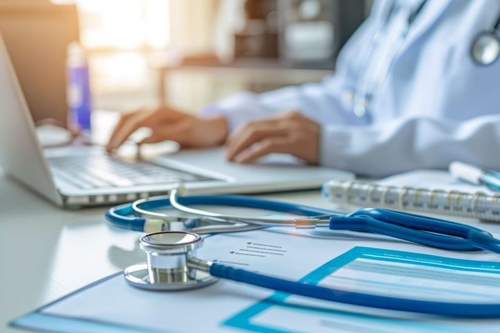A physician enters information for a patient to access via a patient portal.