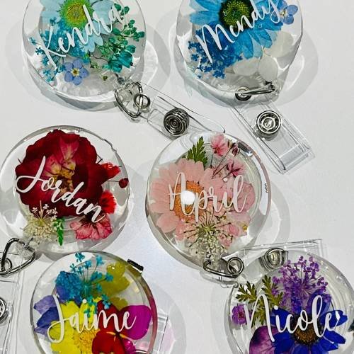 Badge reels with flowers on them.