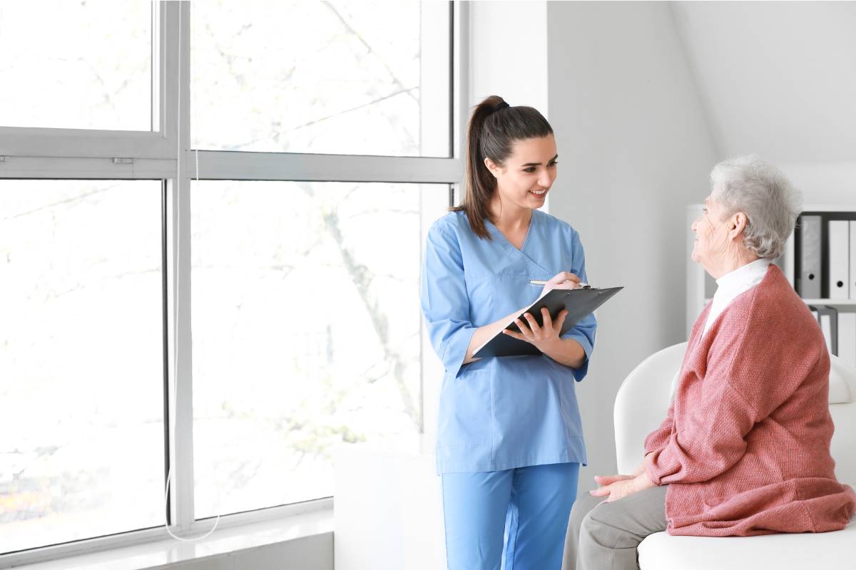 A nurse speaks with a patient about how to become an RN in Indiana.