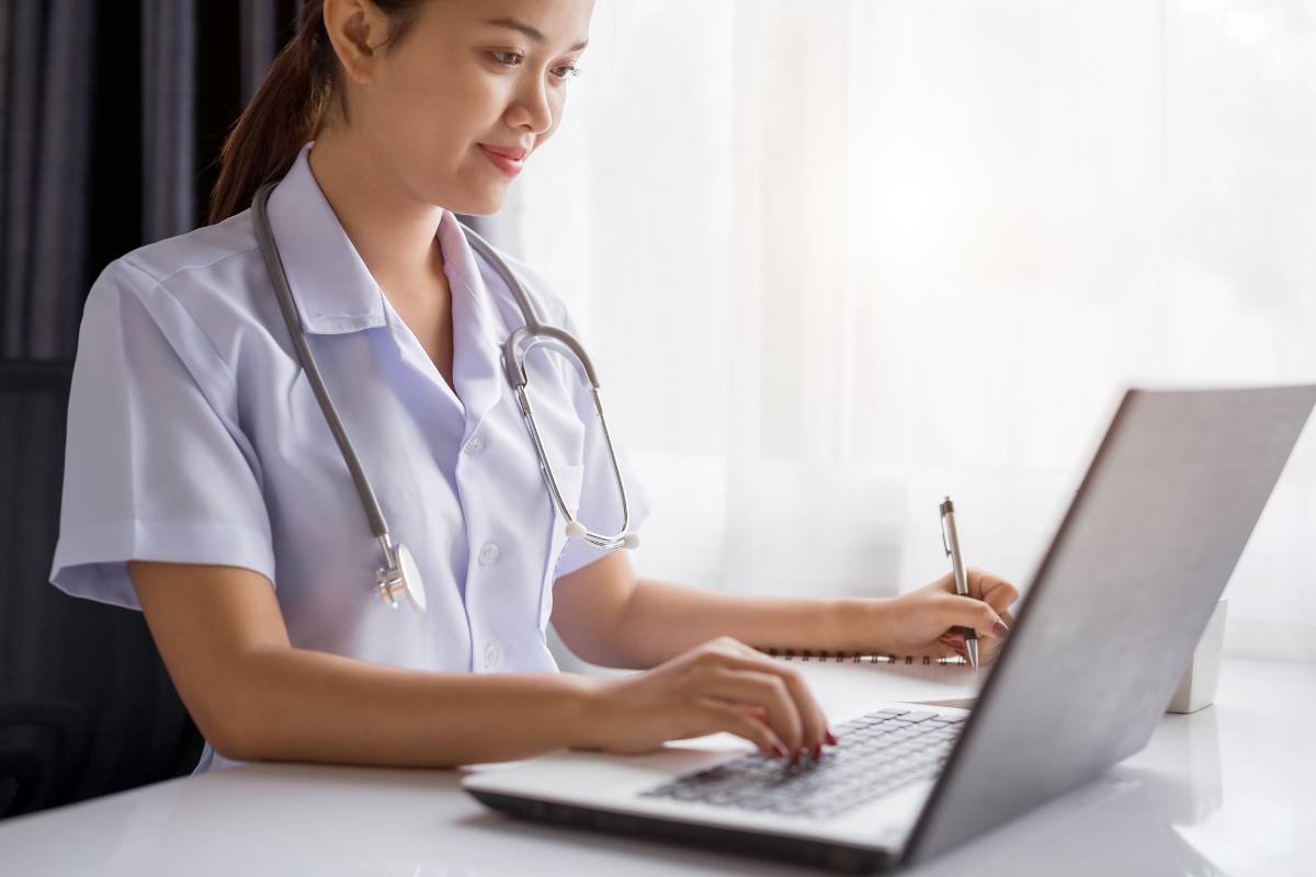 A nurse works on their Arizona nursing license renewal process.