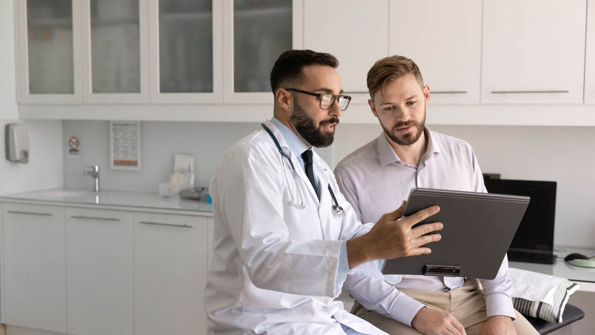 A physician goes over the treatment plan with a patient.
