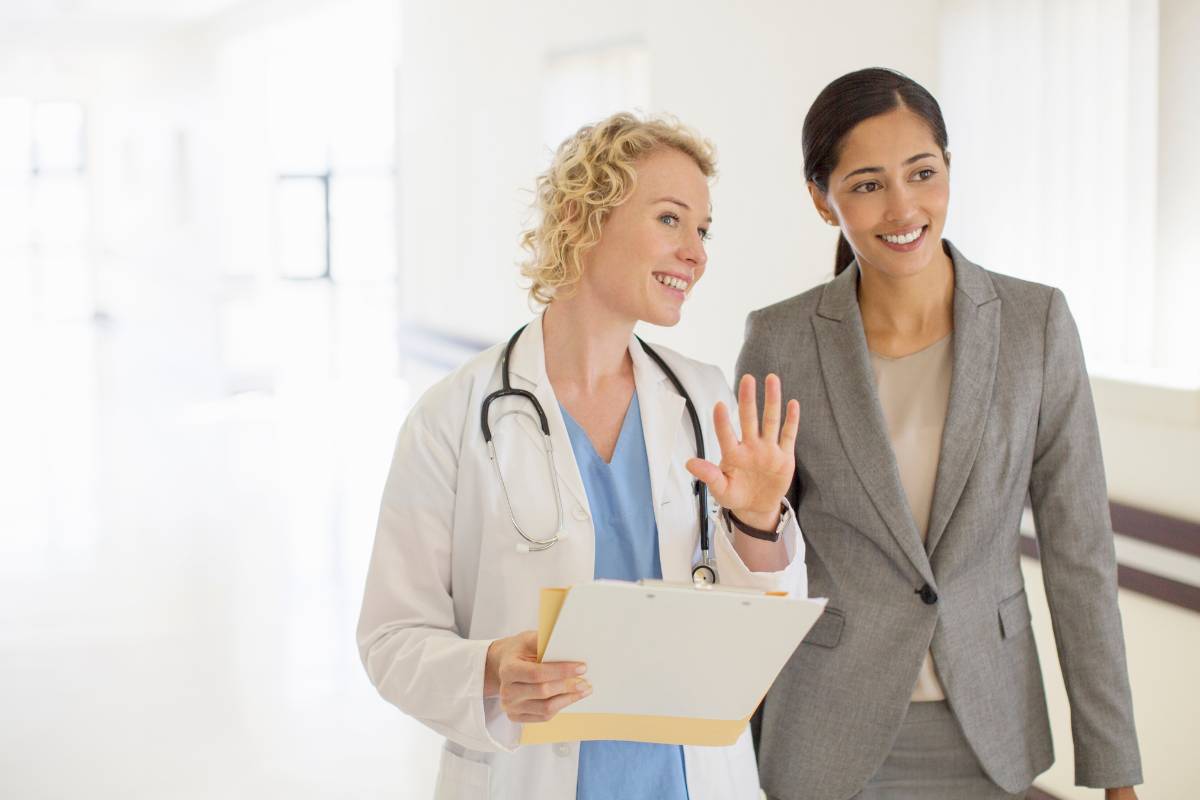 An administrator with CENP certification speaks with a doctor.