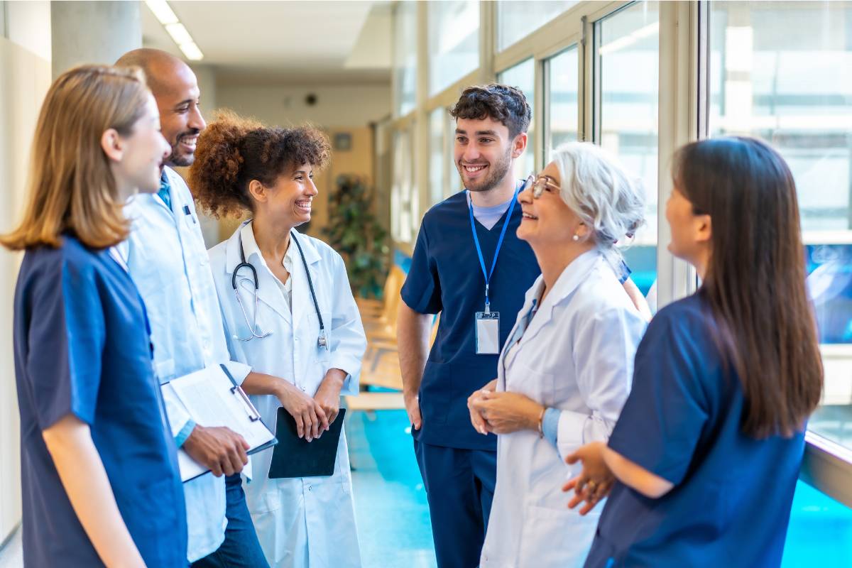 A group of healthcare professionals discuss the APRN consensus model implementation in their state.