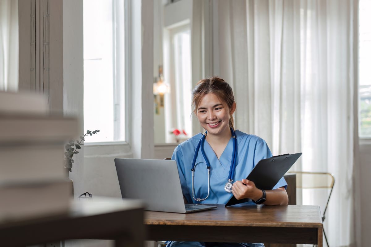 A nurse manager goes over resumes, incorporating exclusion screening as part of the process.