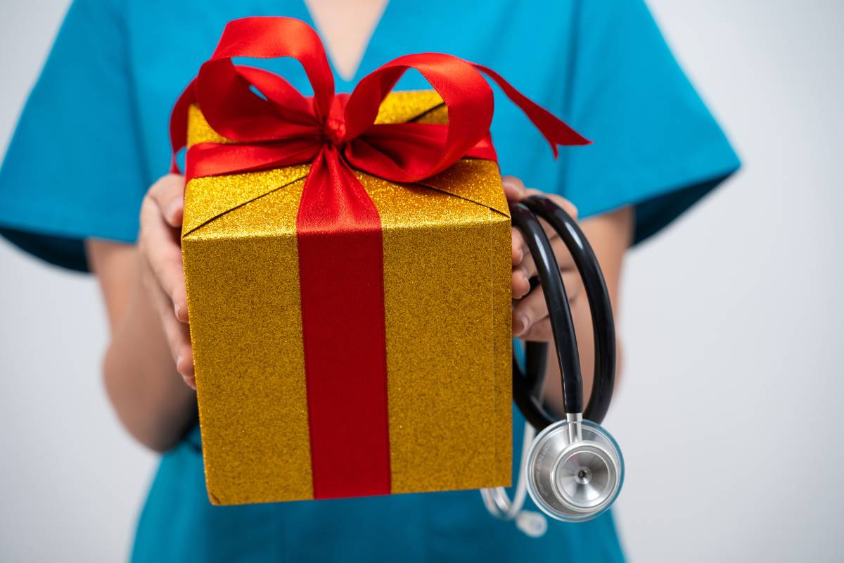 A nurse holds one of her best gifts for nurses during the holidays.