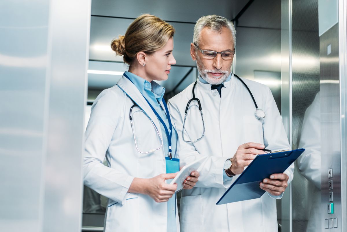 Two physicians use a health information exchange to access patient data.
