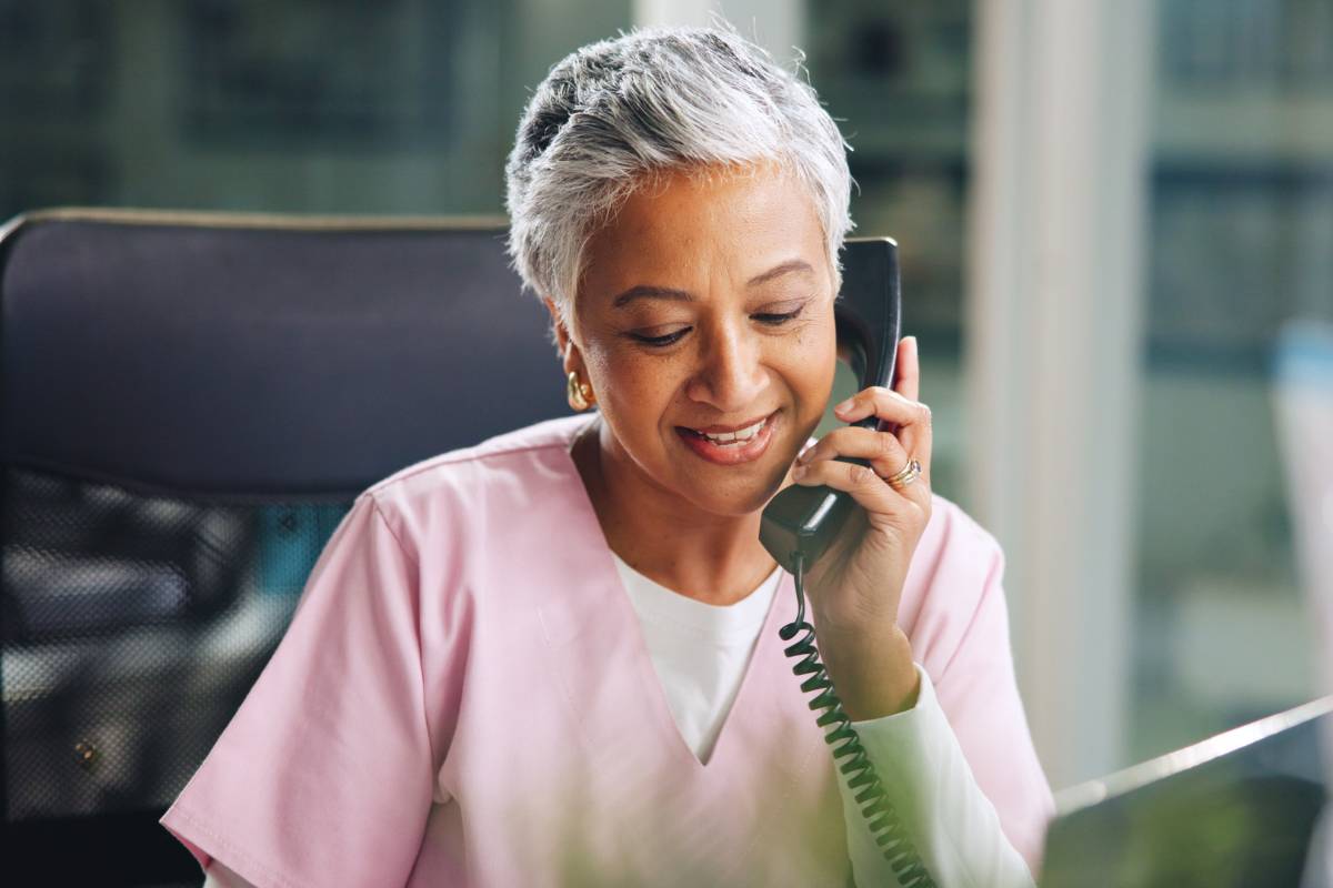 A nurse speaks with a colleague about the highest-paying states for nurses.