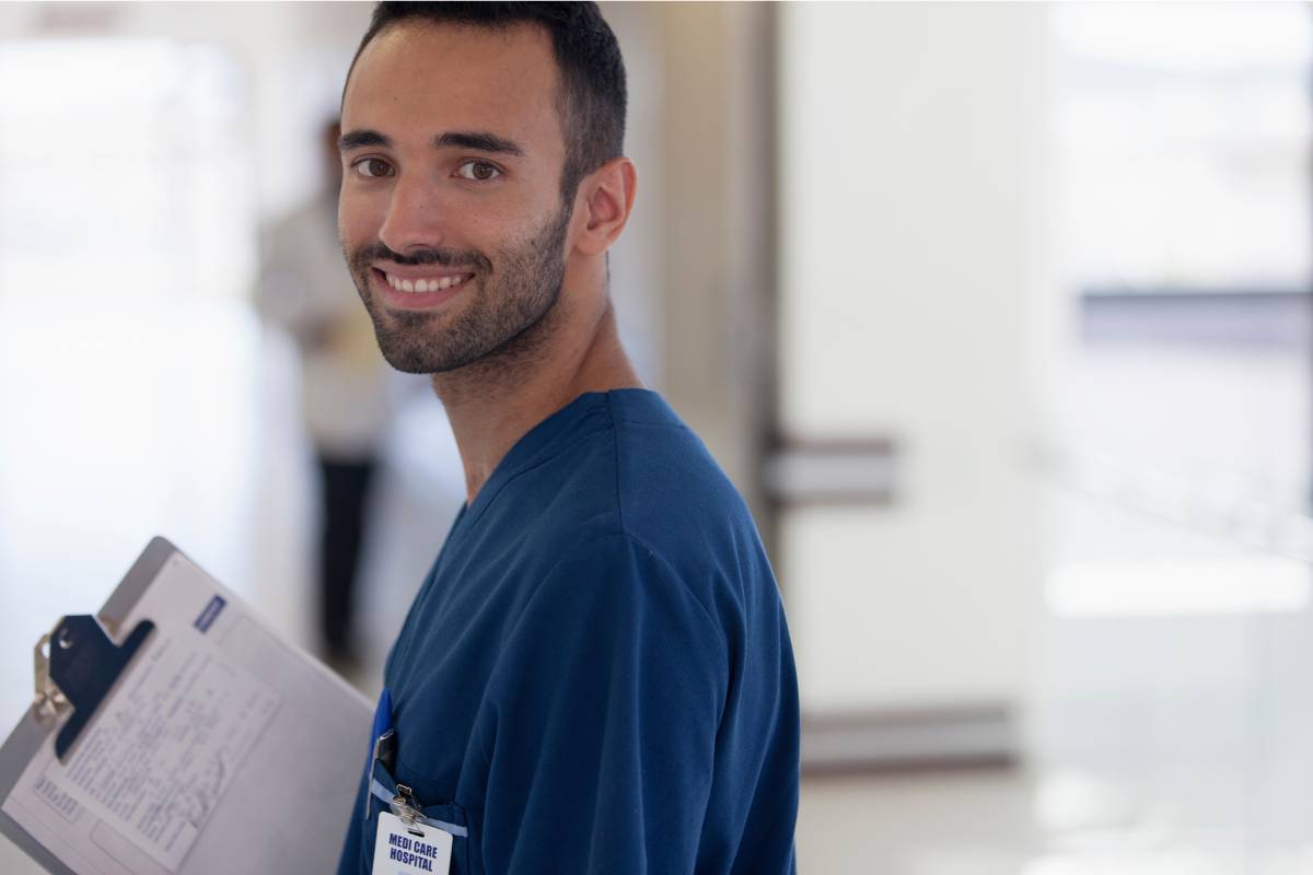 A nurse poses for a photo while discussing how to become an RN in Connecticut.