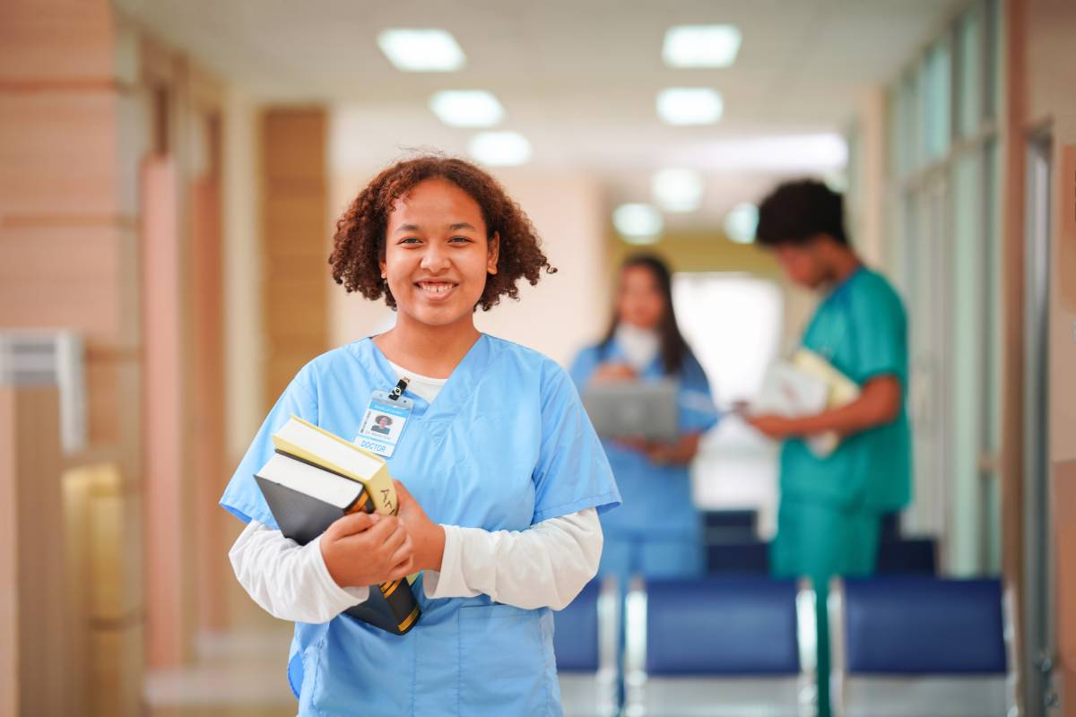 A nursing student poses for a photo while discussing how to become an RN in New Mexico.