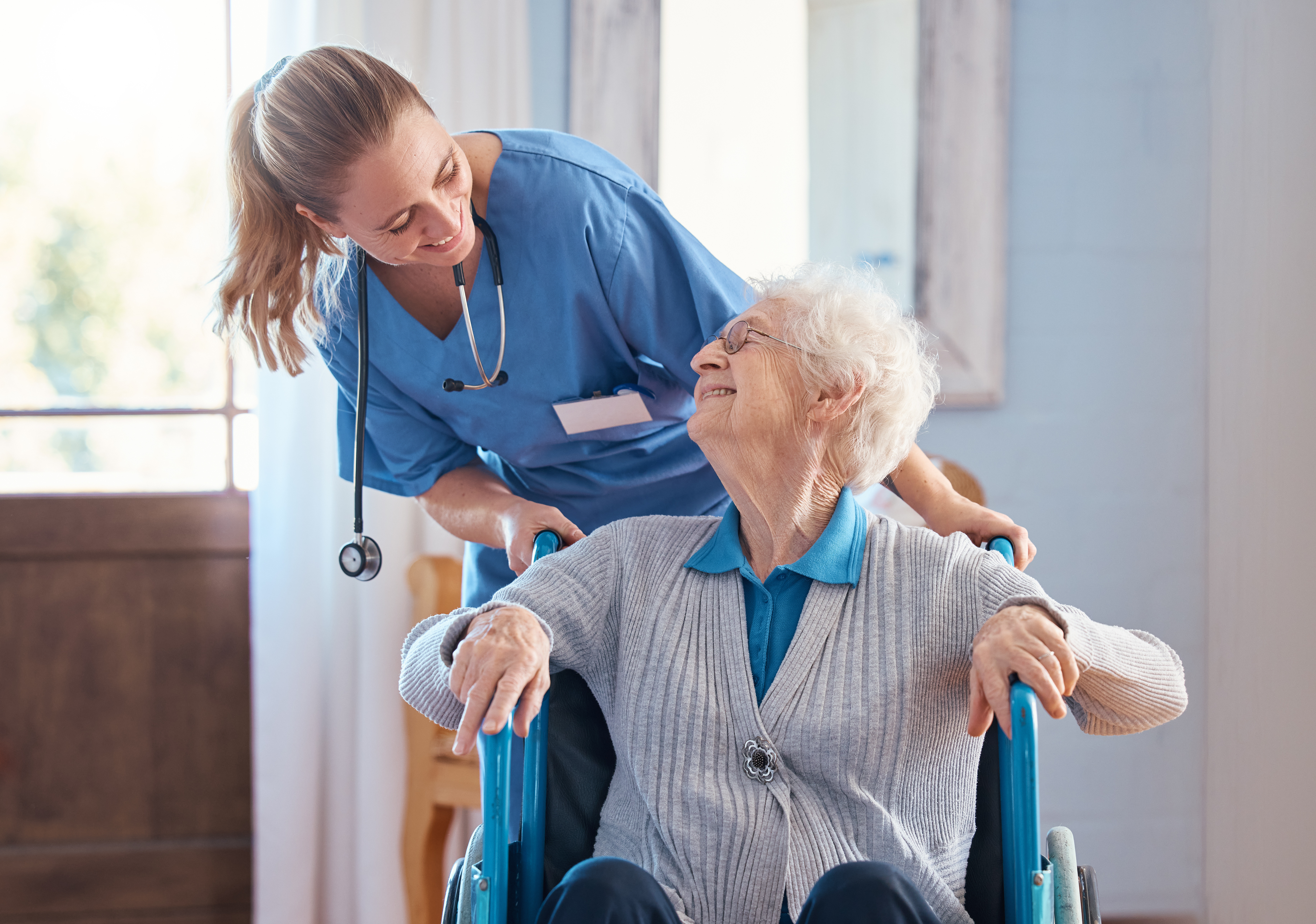 Certified Nursing Assistant helping a patient in a Florida care setting