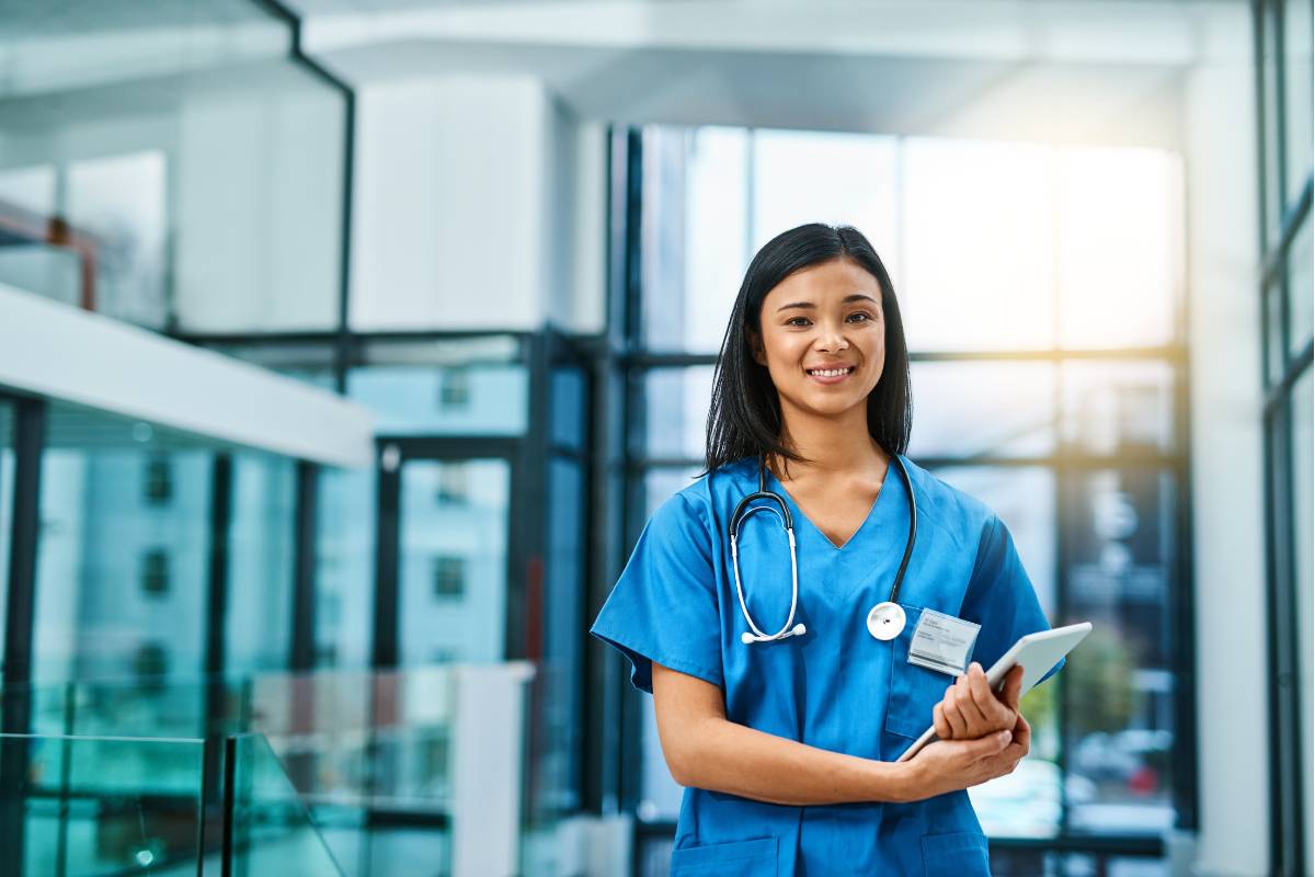 An ICU nurse stands in the hospital before her shift.
