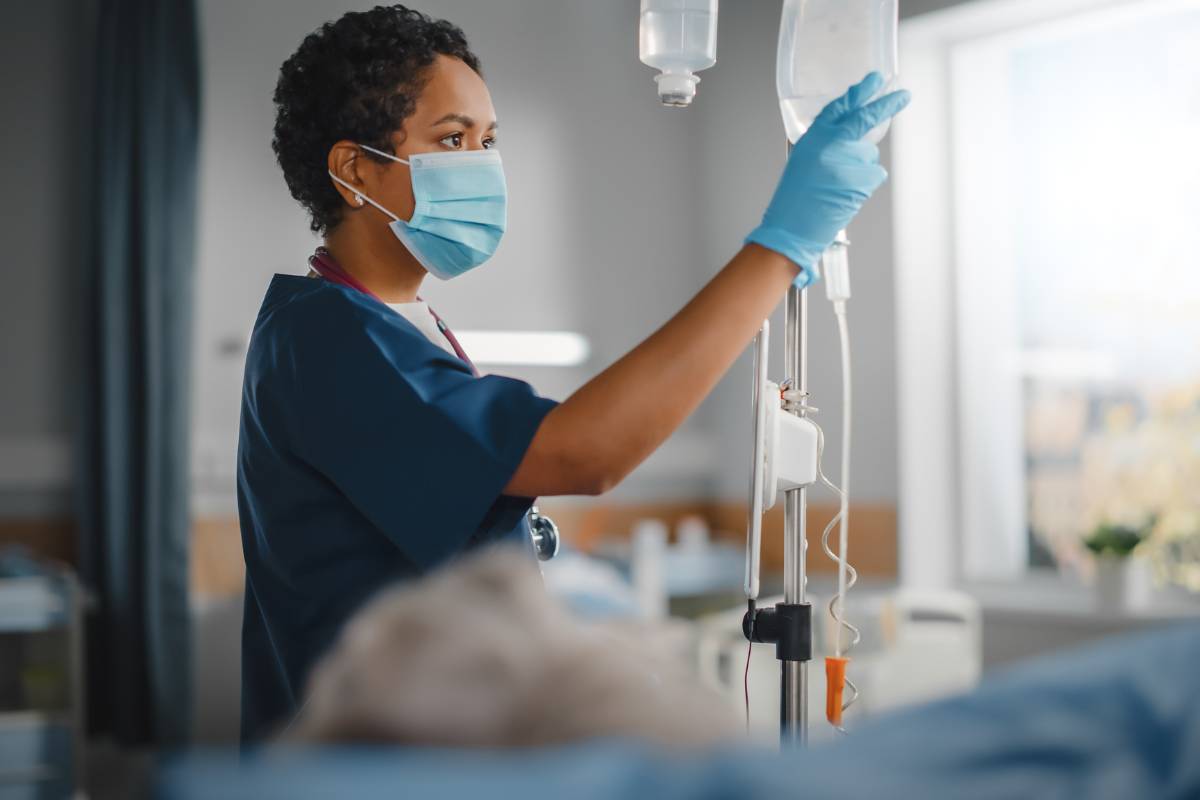 A nurse uses her IV certification skills.