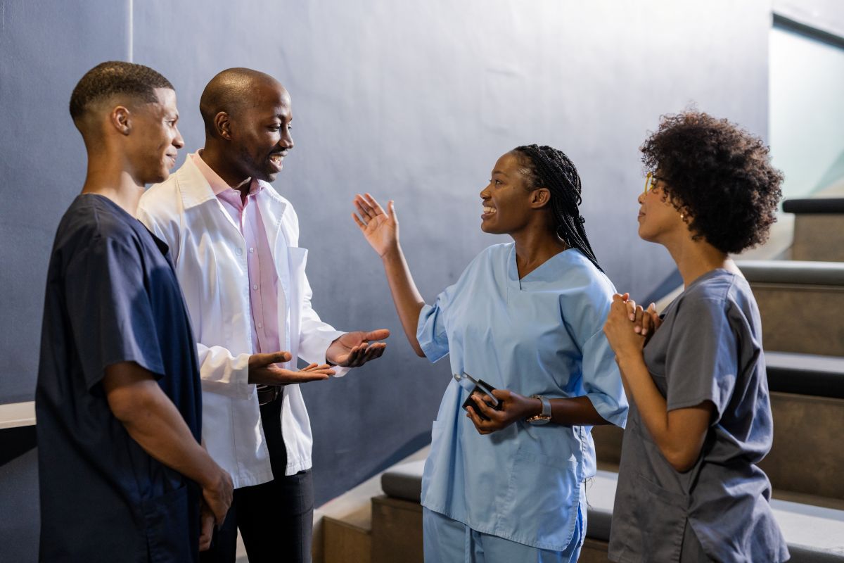 A nurse manager works with a team of healthcare professionals to help set leadership development goals.